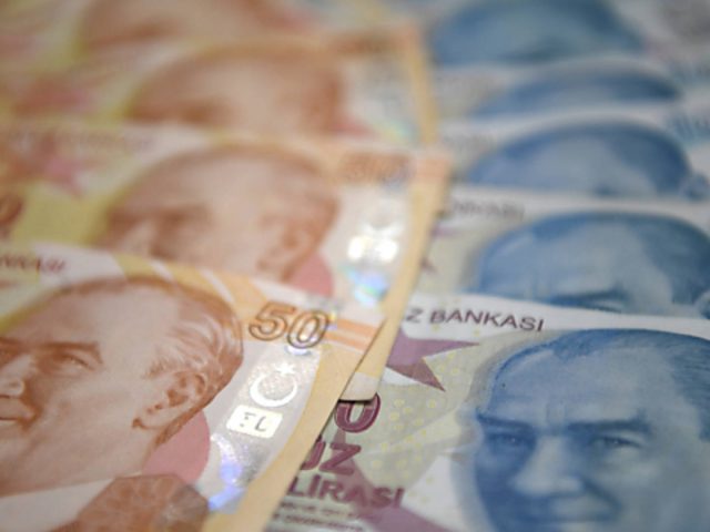 Turkish lira holds firm after wild ride; World Bank cuts growth view