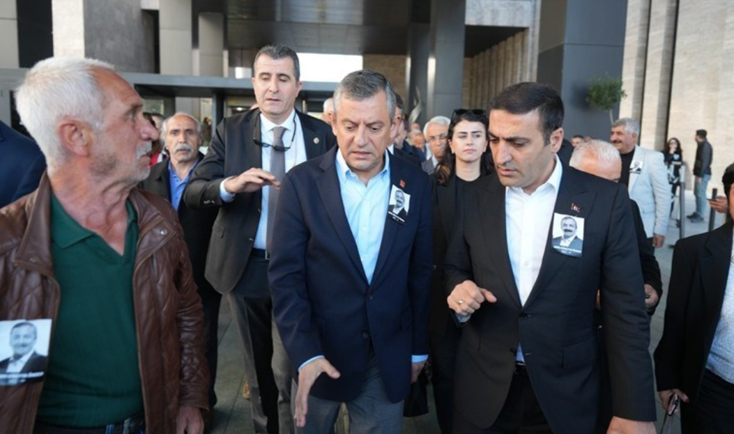 Assailant on the left of the picture, wearing brown leather jacket